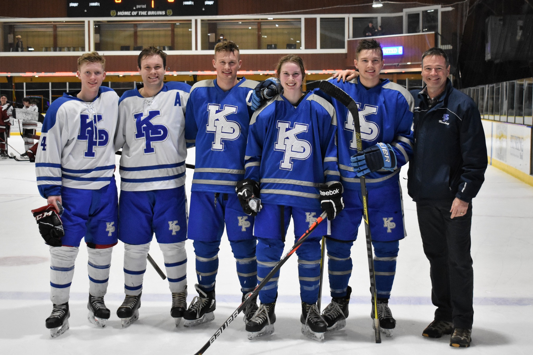 Five students in their hokey uniforms.
