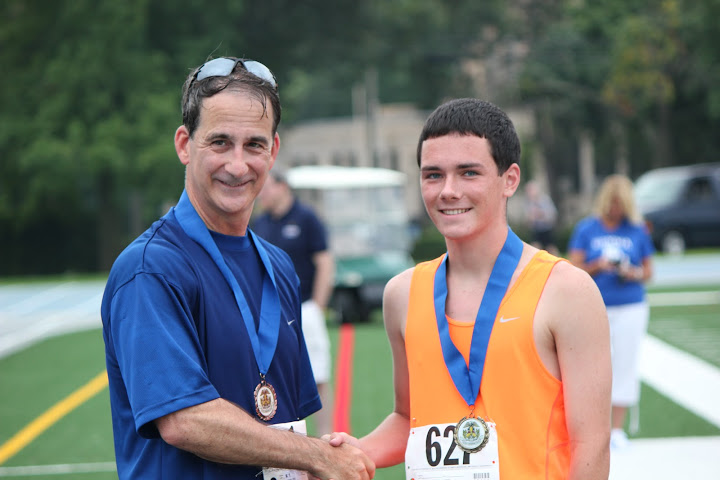 RADM Helis and Connor Clarke after 2012 Alumni/Midshipmen 5K