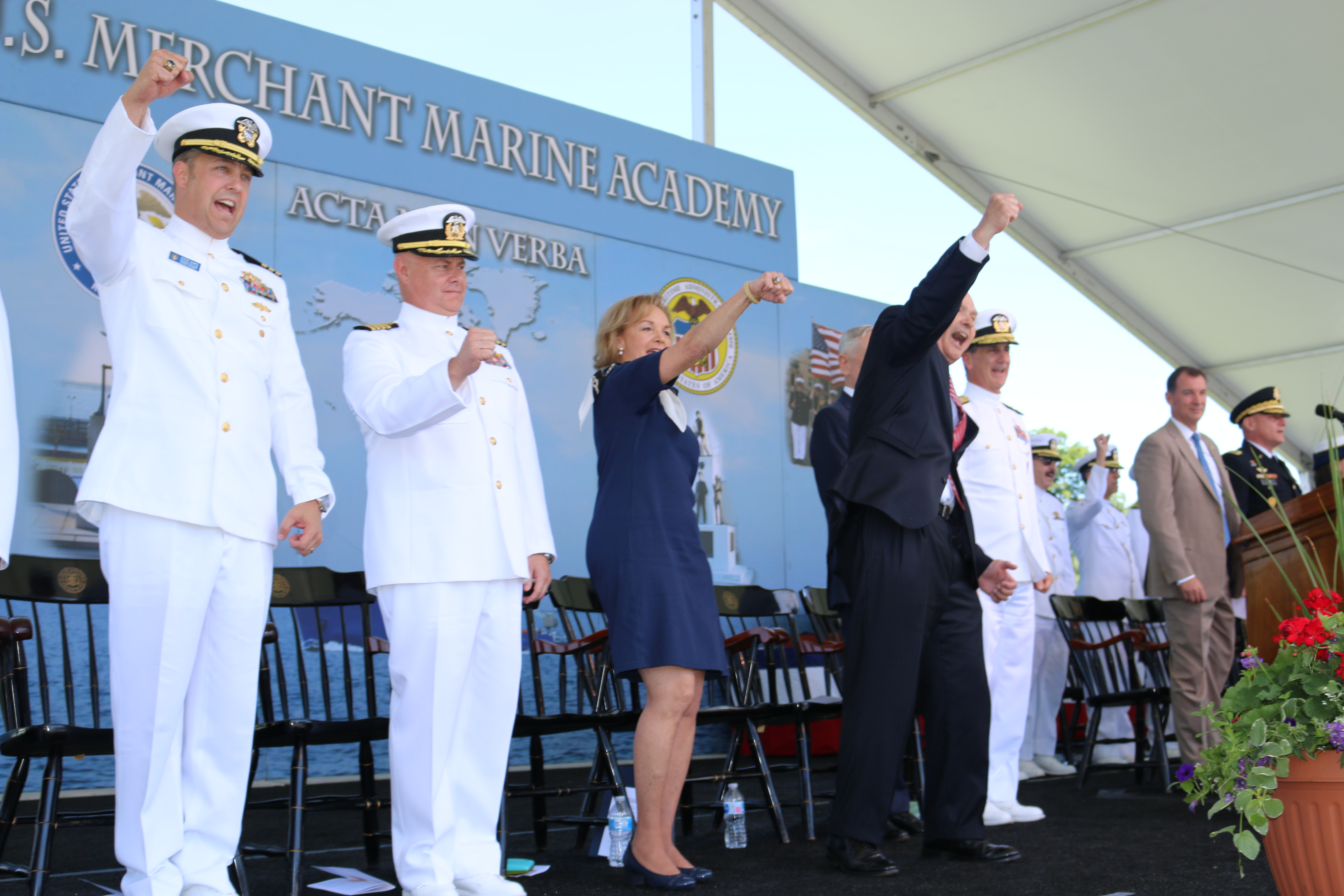 Singing "Damn the submarines, we're the men of the merchant marine"