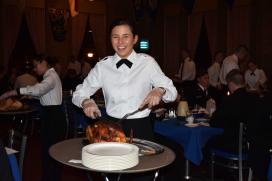 Plebe Veronica Grabiak carves the turkey