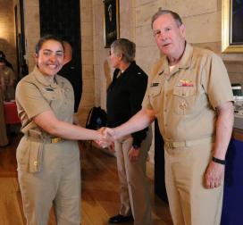 Rear Admiral Ballard congratulates Midshipman Morgan Fortin, 2c