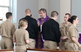 Father Mirek Lesiecki, CP, distributes ashes during Ash Wednesday Mass. Father Mirek Lesiecki, CP, distributes ashes during Ash Wednesday Mass.