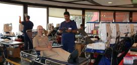 Plebe Liam Wood happlily prepares to donate Plebe Liam Wood happlily prepares to donate