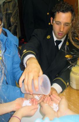 Midshipman 1st Class Timothy Parker gives a “hands-on” science demonstration. Midshipman 1st Class Timothy Parker gives a “hands-on” science demonstration.